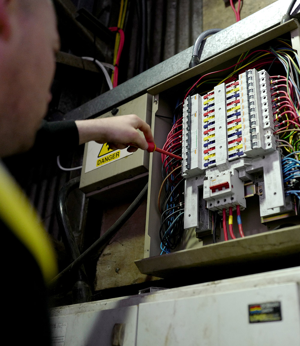Man working on a fuse box